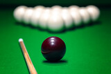 Fototapeta Sypialnia - Ball is displayed on the pool table against the background of other balls and cue