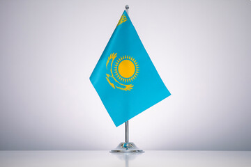 Wall Mural - Kazakhstan flag with a gray and clean background.