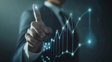 Wall Mural - close-up of a businessman's hand interacting with a futuristic digital interface with glowing graphs and data analytics visualization.