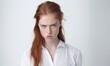 © Daniela - Angry woman on white background. Anger expression concept.