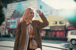 © chokniti - Asian woman friends shopping together at Shibuya district, Tokyo, Japan with crowd of people walking in the city. Attractive girl enjoy and fun outdoor lifestyle travel city in autumn holiday vacation