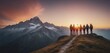Panoramic view of team of people holding hands and helping each other reach the mountain top in spectacular mountain sunset landscape