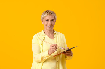 Sticker - Mature female artist with tools on yellow background