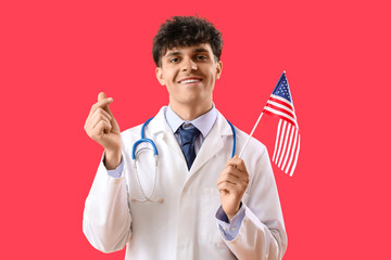 Sticker - Male doctor with USA flag making heart shape on red background