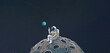 Astronaut sitting on the moon using a smartphone