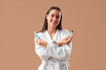 Canvas Print - Young woman with remedies for hair loss treatment on beige background