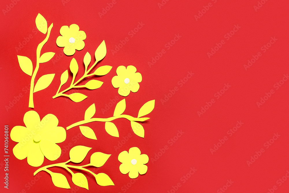 Beautiful paper flowers and leaves on red background