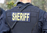 Fototapeta  - Close up on Sheriff title logo on back of flack jacket.