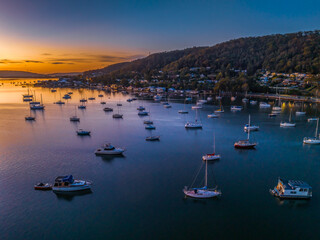 Wall Mural - Aerial sunrise waterscape with boats