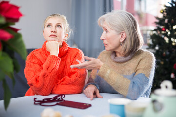 Wall Mural - Home quarrel between mom and daughter during christmas