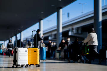 Wall Mural - Travel, Two suitcases in an empty airport hall, traveler cases in the departure airport terminal waiting for the area, vacation concept, blank space for text message or design