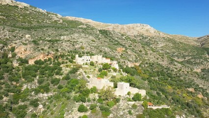 Sticker - The traditional village of Porto Kagio on the mountainside in Europe, Greece, Peloponnese, Mani in summer on a sunny day.