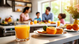 Fototapeta Zachód słońca - Healthy breakfast with orange juice, bread and fruit on table in kitchen