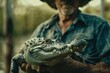 Farmer holding a crocodile, crocodile farm background 