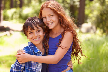 Wall Mural - Happy children, portrait and hug with embrace for holiday, weekend or care together in nature. Little girl, boy and kids with smile for support, trust or friends enjoying summer day at outdoor forest