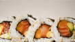 Full plate of maki shushi top view with white background.