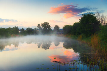 Wall Mural - Beautiful summer landscape at sunrise. Morning fog over the river.