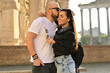 © Striker777 - Happy  Beautiful smiling Tourists  couple traveling together on romantic travel vacation holiday in Europe. Visiting italian famous landmarks at Rome.Hugging near the Roman Forums