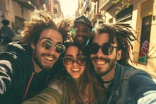 Outdoor selfie taken by multi racial girls and guys with backlight - Happy life style concept on young multiracial best friends having fun in Barcelona - Warm vivid filter.
