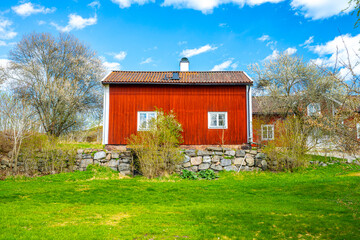 Wall Mural - A typical Swedish red house on a beautiful sunny day, Falu Rödfärg