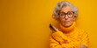 Portrait of mature lady in knit jumper confused using smartphone when someone stolen her privacy data isolated on yellow color background