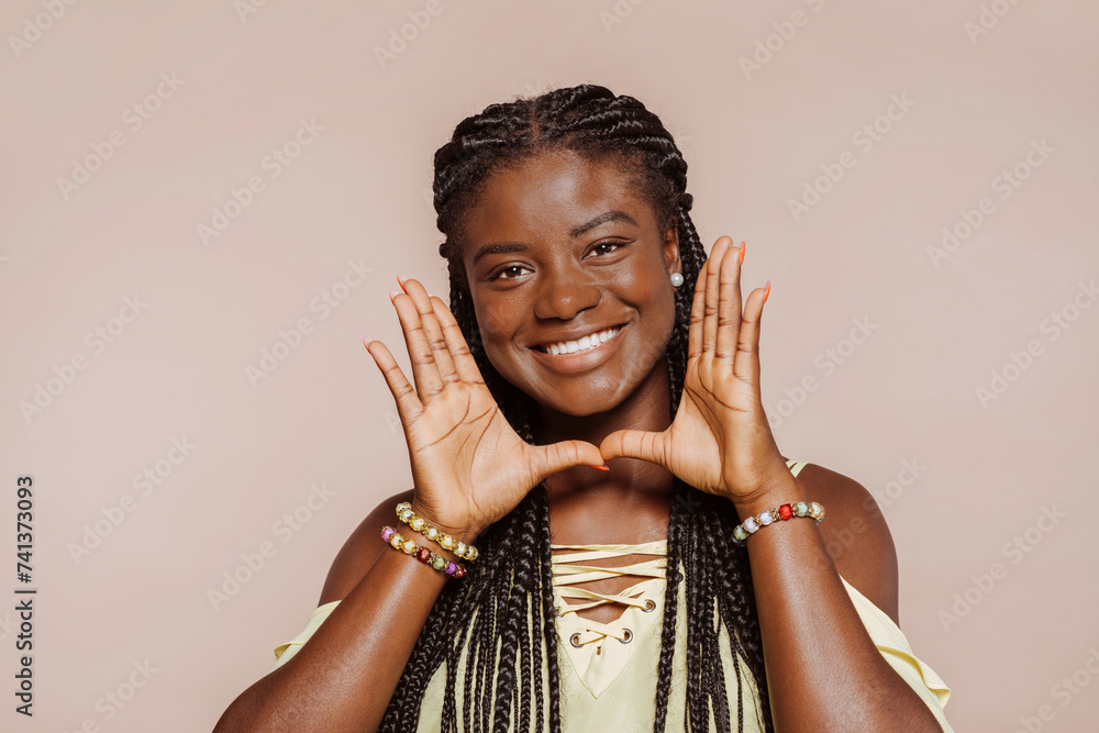 Beautiful african american woman with braided hair, happy smiling ...