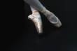 © Jack Tamrong - Close up pointe ballet dancer shoes on black background