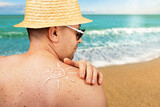 Fototapeta  - Middle aged caucasian male model applying sunscreen