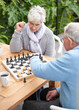 © peopleimages.com - Chess, strategy and senior couple thinking while playing a board game in the backyard or bonding together. Mind, relax or challenge with an elderly man or old woman in the garden for hobby and coffee