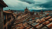 View of rooftops in Cuzco cityscape.