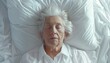 Elderly woman peacefully sleeping in a comfortable white bed at home with space for text