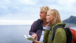 © Mapodile M./peopleimages.com - Couple, thinking and map by ocean for hiking, direction or location on outdoor adventure together in nature. Young man and woman reading tour or travel guide for route, path or destination on hike