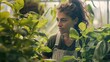 Latin woman working inside greenhouse garden Nursery and spring concept