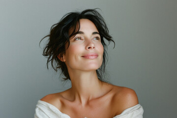 Wall Mural - happy attractive confident young adult or mid aged european woman posing for beauty aesthetic portra