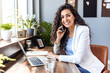 © Dragana Gordic - Woman working on laptop online, checking emails and planning on the internet while sitting in an office alone at work. Business woman, corporate professional or manager searching the internet