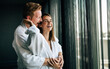© NDABCREATIVITY - Happy young couple in love enjoying wellness spa resort treatments.
