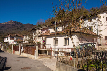 Wall Mural - A residential street in the mountain village of Cedarchis near Arta Terme in Carnia, Friuli-Venezia Giulia, north east Italy