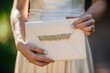 envelope clutch with rhinestones held by bride