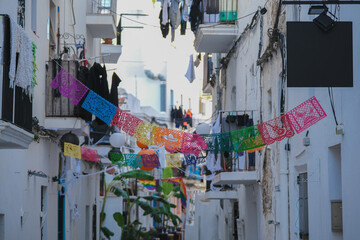 Wall Mural - Romantic backstreet, side street and alleys in historic old town of Ibiza Stadt, Balearic Island with historic Mediterranean style architecture facades, a landmark sightseeing tourist spot in downtown