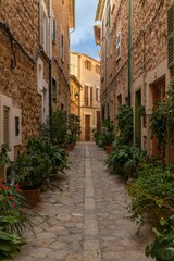  vertical view of a picturesque village street in the quaint mountain town of Fornalutx in northern Mallorca
