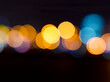 © Olena Poberezhna - Night abstract city in blurry lights with bokeh effect..