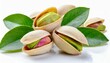 Flat lay of pistachio nuts with leaves on a white background