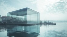 An Awe-inspiring Glass Building Rises From The Tranquil Waters Of The Lake, Its Towering Structure Mirrored In The Sky Above As Boats Glide By, A Breathtaking Fusion Of Modern Architecture And Natura