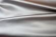 © Adobe Contributor - Close-up of a crumpled silver silk fabric
