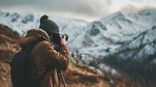 Tourist With Camera Travels And Takes Pictures Of Beautiful Mountains