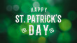 Happy St. Patrick's Day Text Over Green Nature Bokeh Background. Banner for web with Bokeh lights