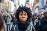 Fototapeta Uliczki - black woman on a busy pedestrian street