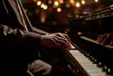 Jazz Pianist, hands of an elegant man playing the white keys of his instrument in a concert of classical music and improvisation