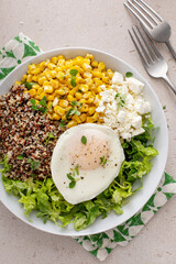 Wall Mural - Quinoa breakfast bowl with lettuce, fried egg and corn