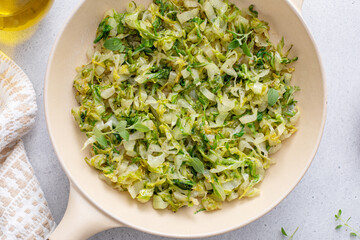 Canvas Print - Sauteed green cabbage or lettuce, healthy side dish idea